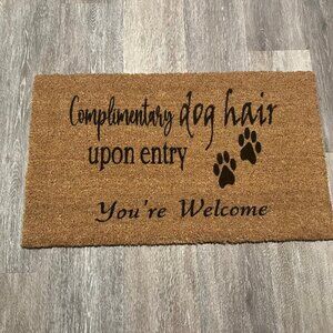 Complimentary dog hair upon entry...You're Welcome decorative coir doormat